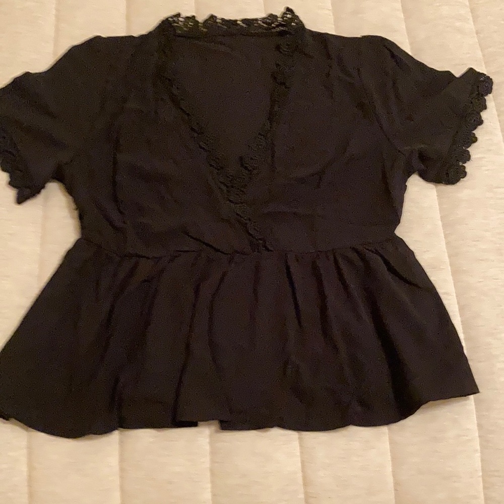 Black blouse with embroidered neckline and sleeves